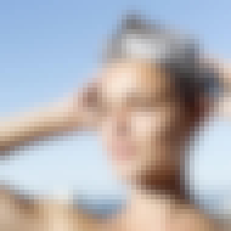 portrait of a woman shampooing her hair