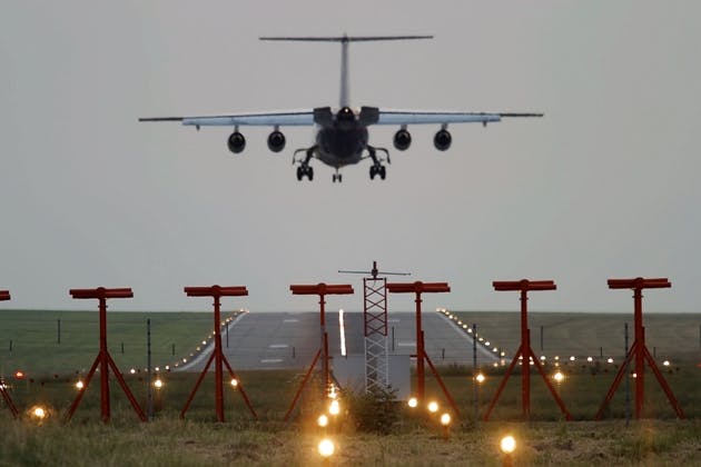 Airplane landing on a runway Airplane landing on a runway